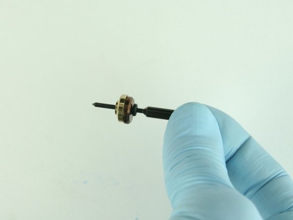 Slide the brass back-up ring on to the valve stem point with the chamfer side away from the stainless steel back-up ring.