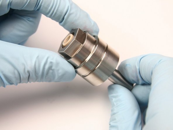 Remove the swivel bearing from the bearing half of the swivel housing by pushing a .300-.360 gauge pin through the bearing half.