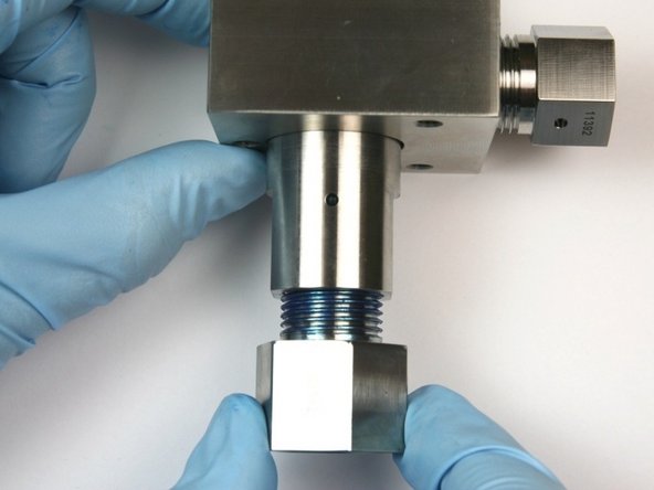 Unthread the outlet fitting from the bleed down valve body.