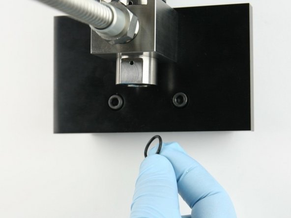 Put the O-ring behind the high-pressure seat so it will be held in place within the valve body.