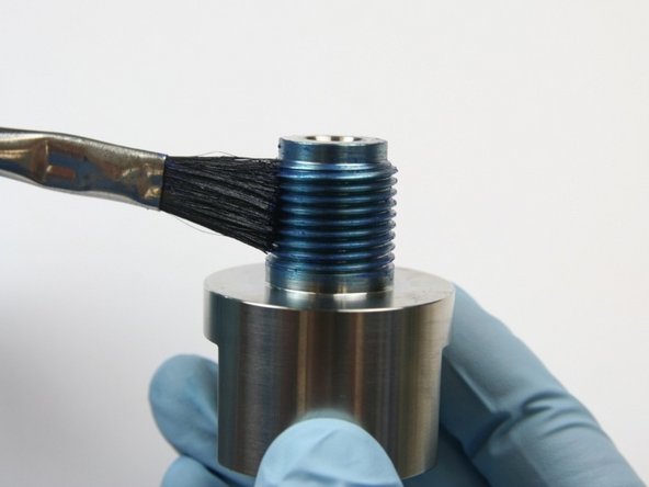 Hand tighten the end cap on to the high-pressure cylinder.