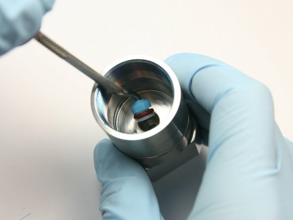 Remove the high-pressure seal from the inside of the seal half of the swivel housing with a pick.