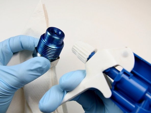 Clean the high-pressure gland fitting of all Blue Goop.