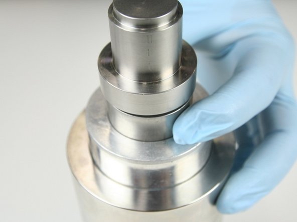 Put the non-stepped end of the push tool into the sleeve and be sure that the tool is level with the sleeve.