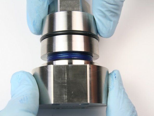 Thread the bearing half onto the seal half of the swivel housing.