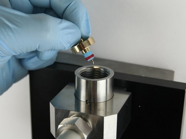 Put the needle point at the top of the valve body.