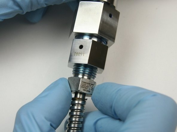 Thread the gland nut into the outlet fitting (connected to the valve body).