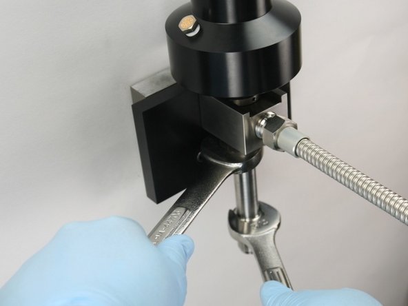 Tighten the nozzle tube to the valve bodye using 3/4" and 7/8" wrench.