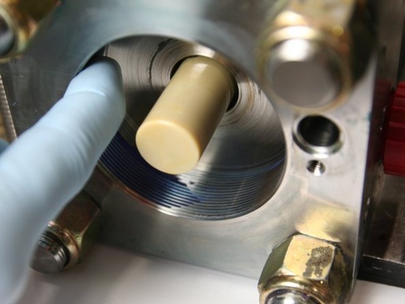 Apply Blue Goop to the  inside threads of the intensifier.