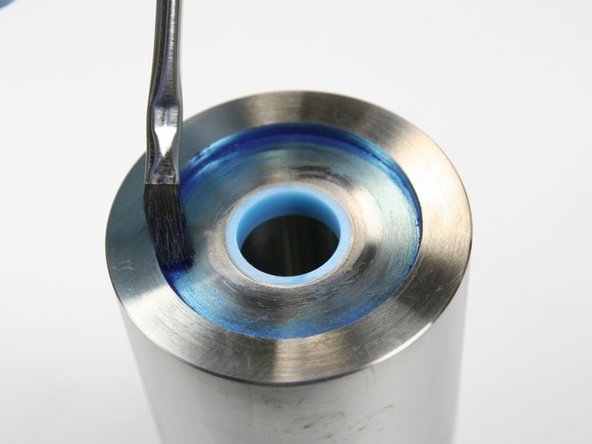 Apply a light coat of blue goop to outer face of inset on end of HP cylinder