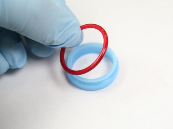 Roll red o-ring into groove on HP seal
