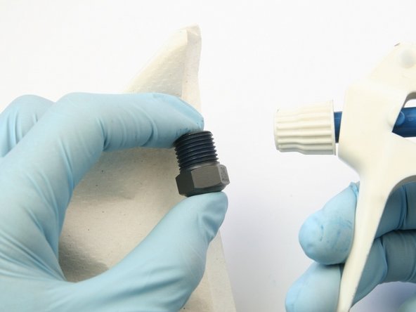 Clean the high-pressure gland of all Blue Goop with isopropyl alcohol.