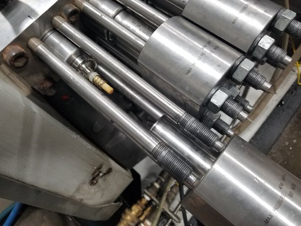 Carefully slide the end cap off, being careful not to lose any of the high-pressure components