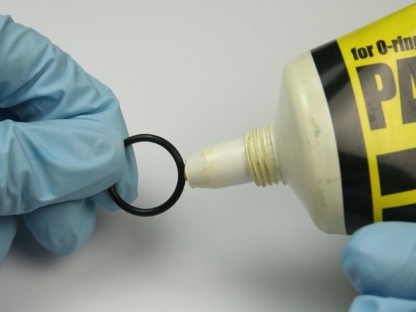 Apply O-ring lube to the smallest O-ring.