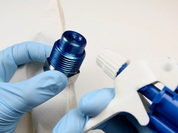 Clean the high-pressure gland fitting of all Blue Goop.