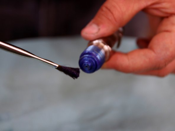 Apply Blue Goop to surfaces at top of Seat and to surface of Seat where Needle sits.