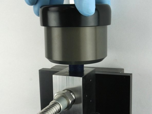 Unthread the actuator from the valve body.