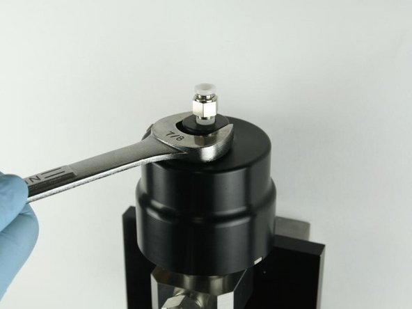 Loosen the actuator from the valve body using a 7/8&quot; wrench.