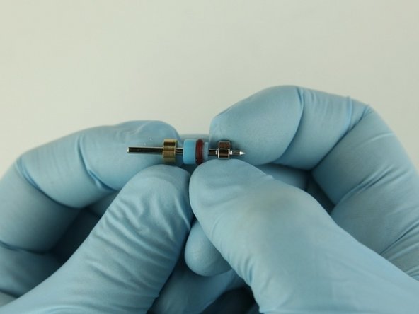 Slide the back-up ring on to the poppet stem behind the high-pressure valve seal.