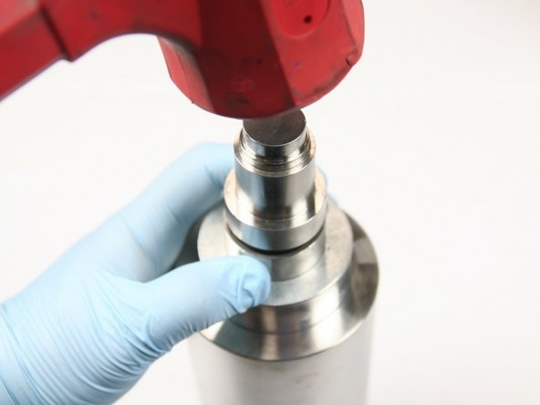 Seat hoop in HP cylinder using non-stepped end of push tool and dead blow hammer