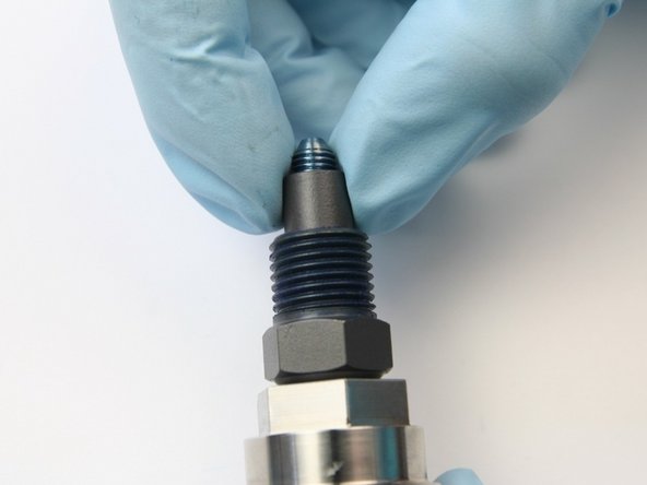 Uthread the high-pressure collar from the threads of the swivel shaft.