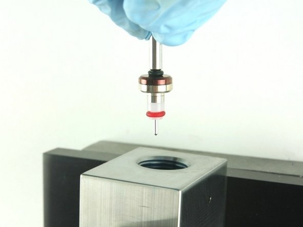 Put the point of the valve stem into the valve body.