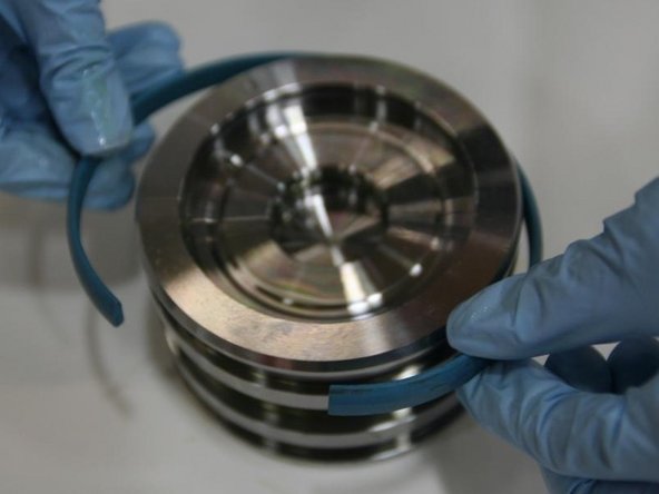 Put the modified wear ring into the top groove of the piston.