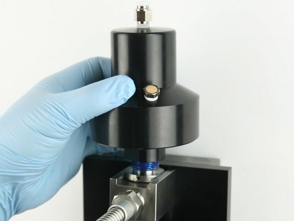 Thread (hand tighten) the actuator on top of the valve body.