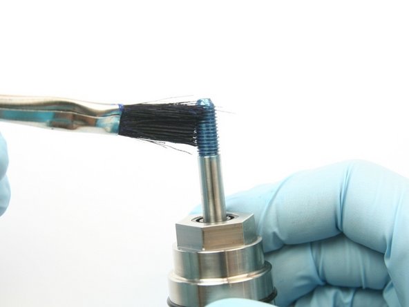 Apply Blue Goop to the swivel shaft threads.