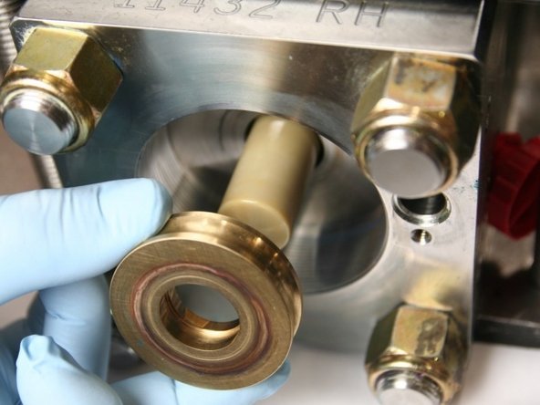 Remove the old bronze back-up ring from the plunger.