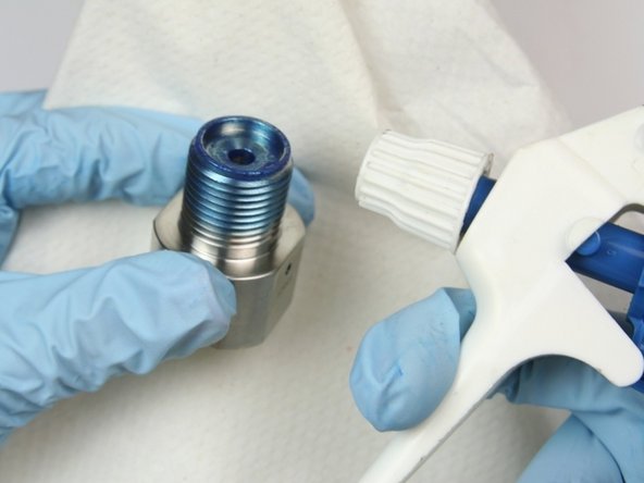 Clean outlet adapter of all blue goop with isopropyl alcohol