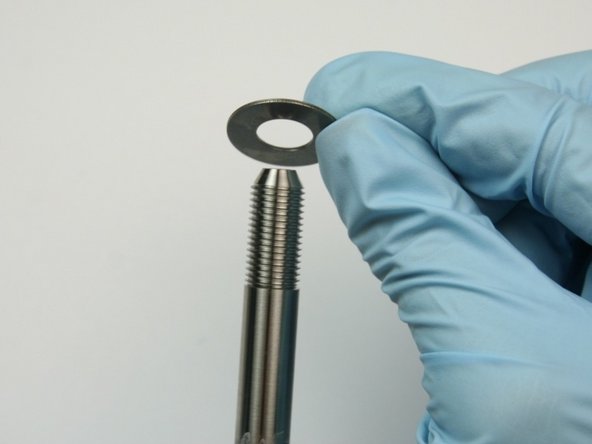 Slide the second thrust washer onto the swivel shaft.