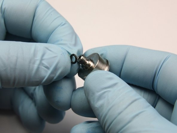 Place the O-ring below the threads of the poppet retainer.