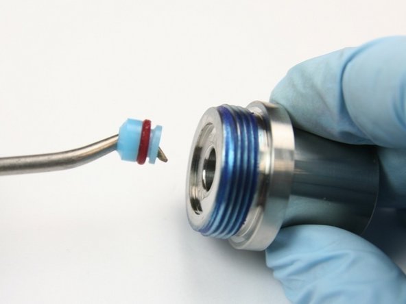 Remove the high pressure seal assembly from the seal half of the swivel housing with a pick.