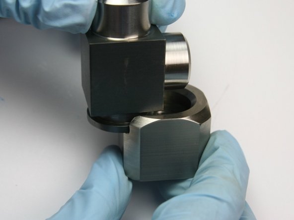 Slide the collar onto the swivel housing so it fits into the groove.