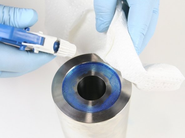 Clean the high-pressure cylinder of all Blue Goop with isopropyl alcohol or a similar cleaning agent.