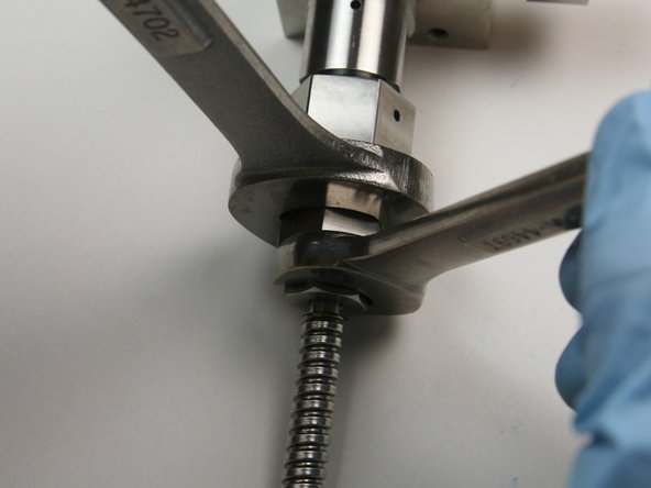 Loosen the gland nut from the outlet fitting (connected to the valve body) using a 13/16" and 5/8" wrench.