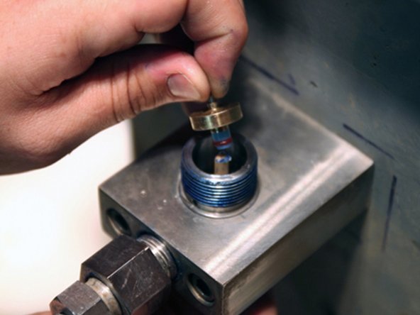 Thoroughly clean interior of valve body with isopropyl alcohol or similar cleaning agent before replacing components.