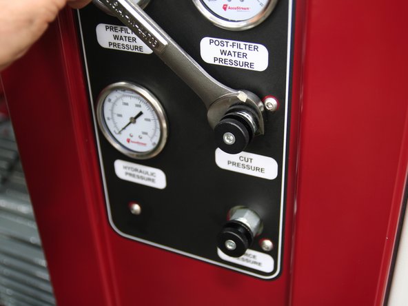 Install control knobs &quot;Cut&quot; and &quot;Pierce&quot; into respective ports on front of manifold.