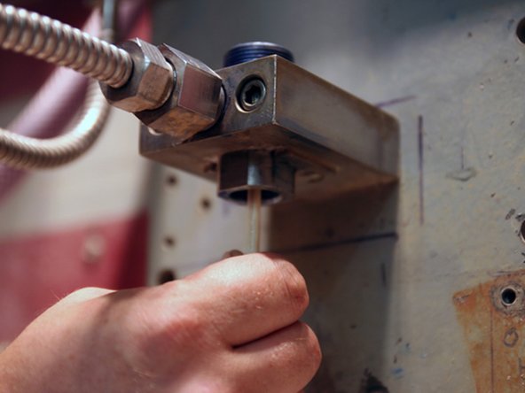 Remove old valve components from valve body with included dowel.