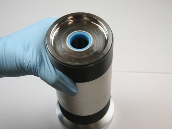 Put the sleeve into the open end of the high-pressure cylinder and repeat the seal installation process.