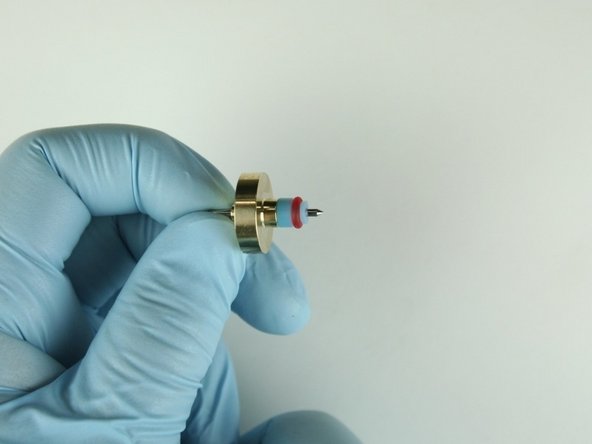 Slide the high-pressure valve seal onto the needle point.