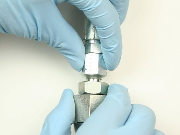 Thread hydraulic hose to hydraulic fitting