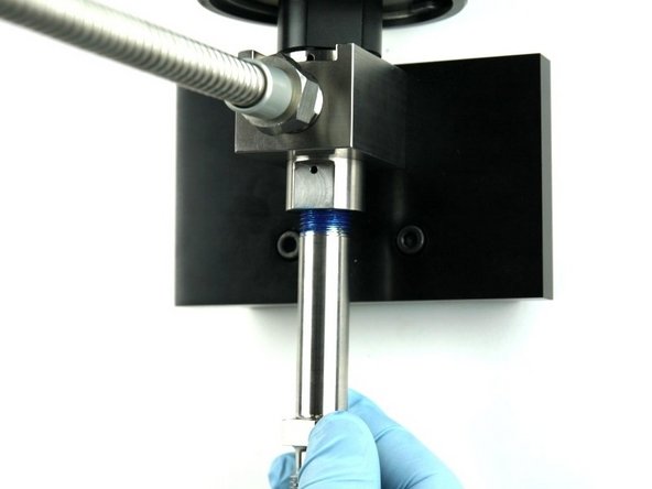 Thread the nozzle tube into the bottom of the valve body.