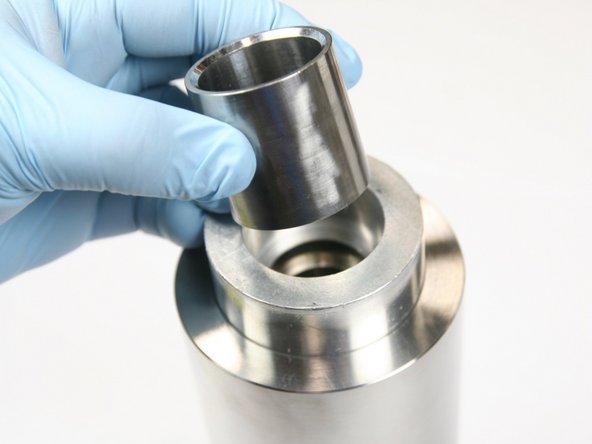 Place sleeve in locator tool with taper end up