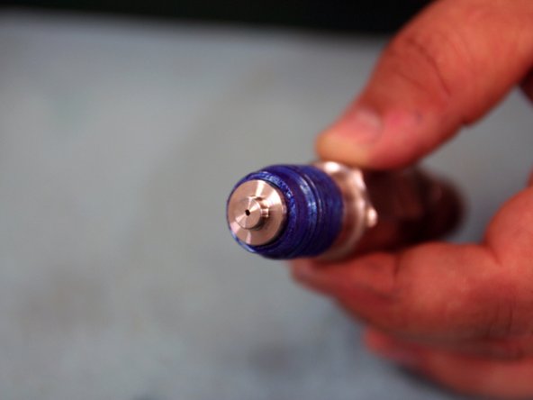 Apply Blue Goop (11111) to top of nozzle tube and insert Seat.