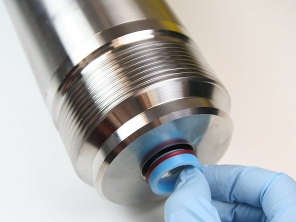 Put the high-pressure seal into the high-pressure cylinder.