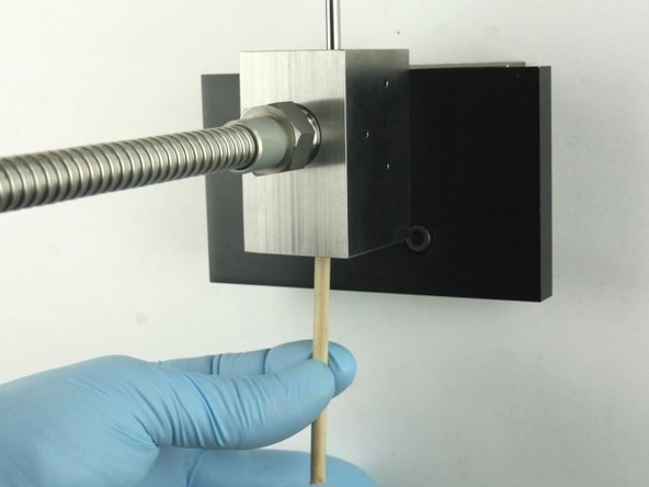 Remove all the valve components from the valve body with the included dowel.