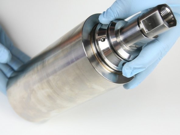 Flip the high-pressure cylinder over so the cylinder is resting on the check valve.