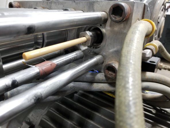 Rotate belt/crank to extend plunger, if necessary